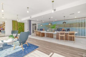 Modern office lobby with sleek furniture, vibrant decor, and natural light. Clean design and inviting atmosphere.